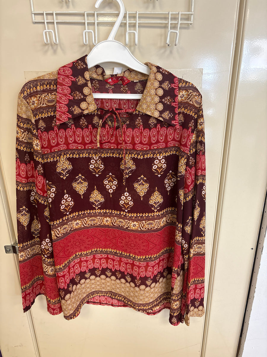 Blouse imprimée rouge et ocre — taille non indiquée — photo 1